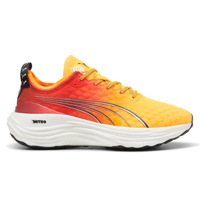 Yellow and red Puma running shoe with white sole on a white background