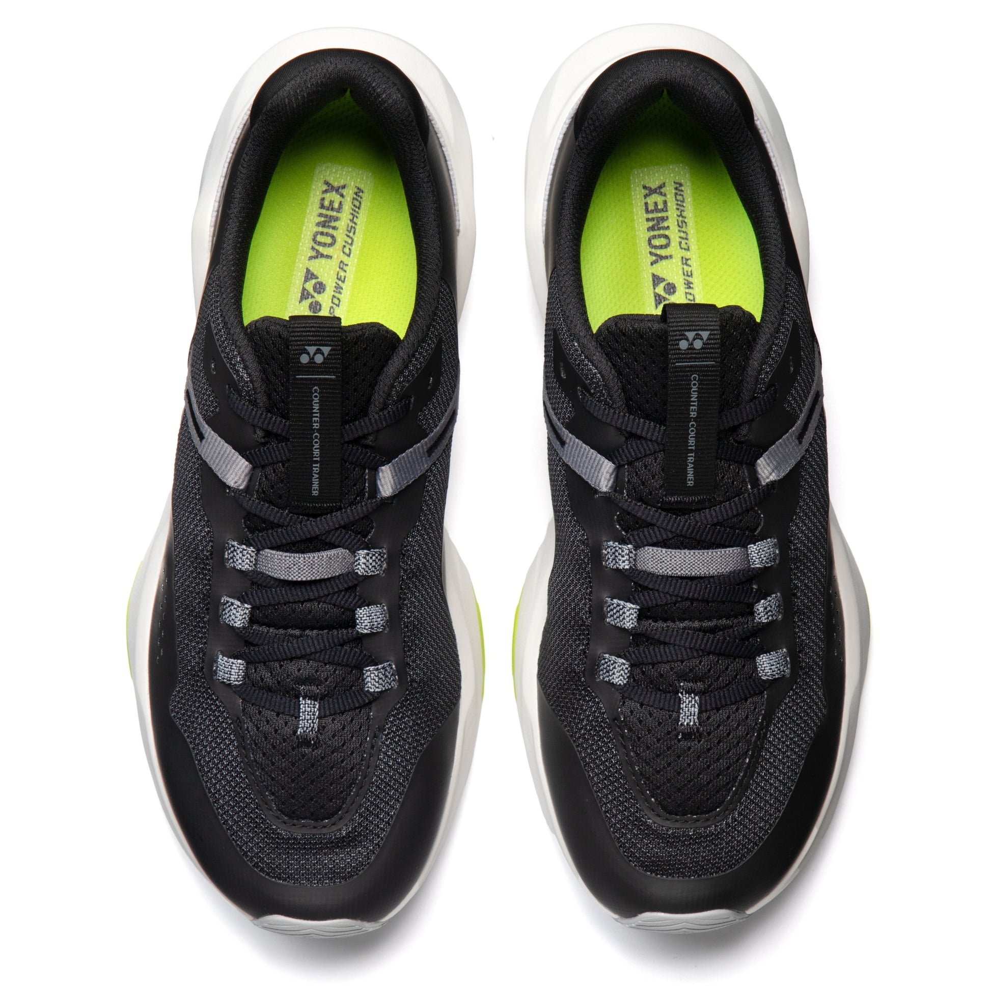 Black running shoes with Yonex branding on a white background