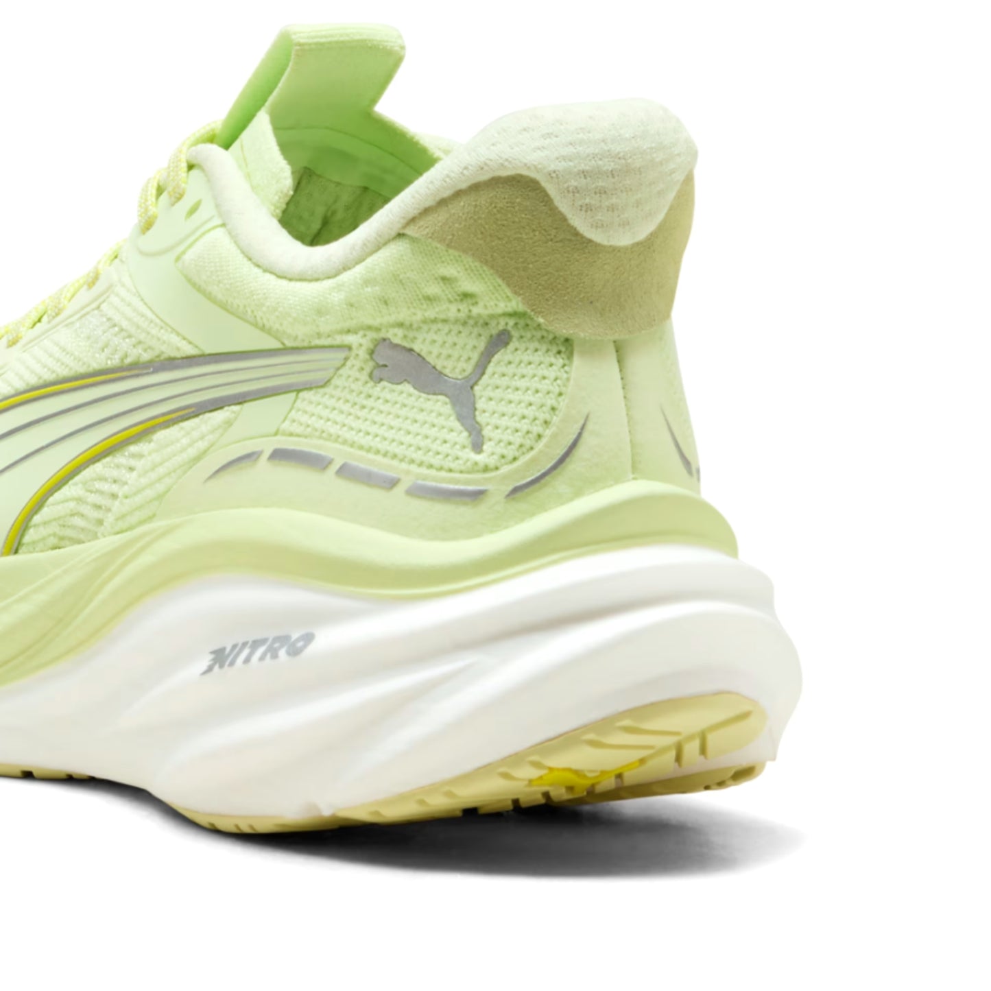 Light green Puma running shoe with Puma logo on a white background