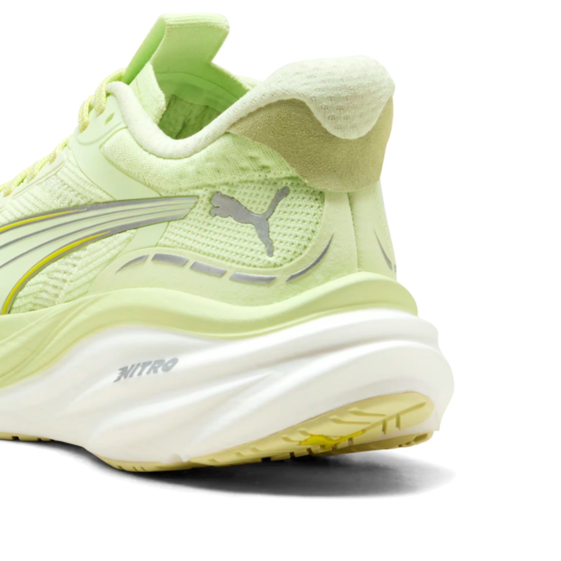 Light green Puma running shoe with Puma logo on a white background