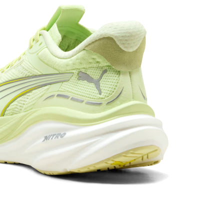Light green Puma running shoe with Puma logo on a white background