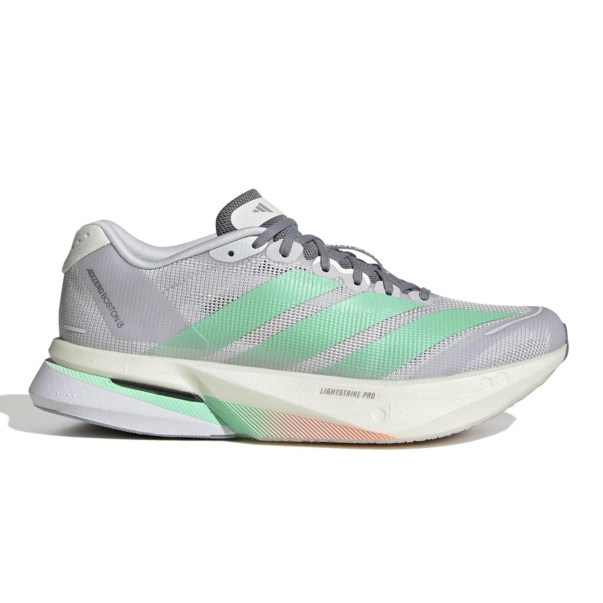 An Adidas running shoe in gray and mint green, featuring the signature three stripes and a white Cloudfoam midsole, shown from a side profile on a white background.