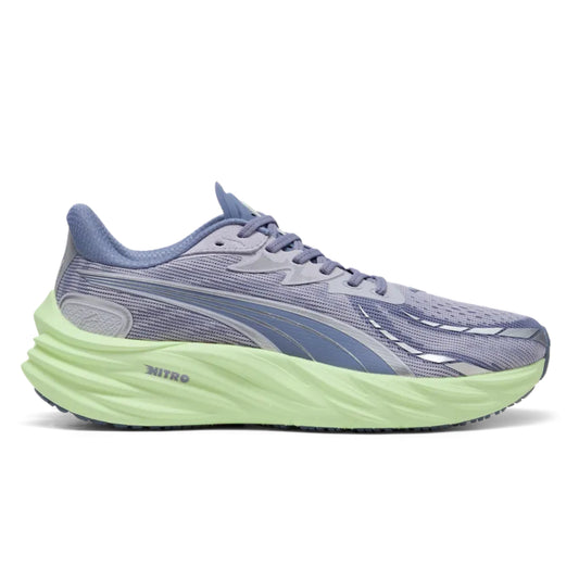 Blue running shoe with a green sole on a white background
