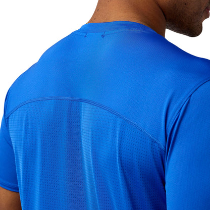 Blue athletic shirt on a person with a white background