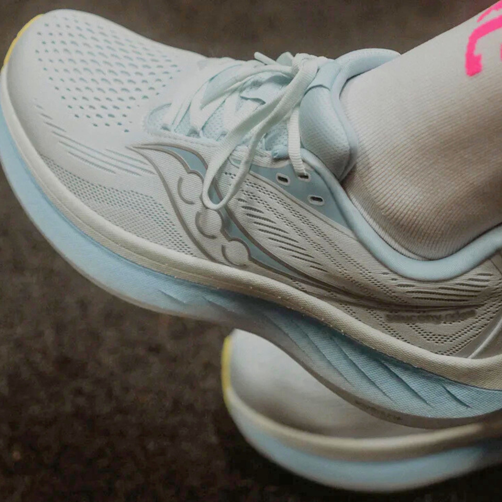 Light blue with ice blue accents and light yellow sole Saucony running shoe 