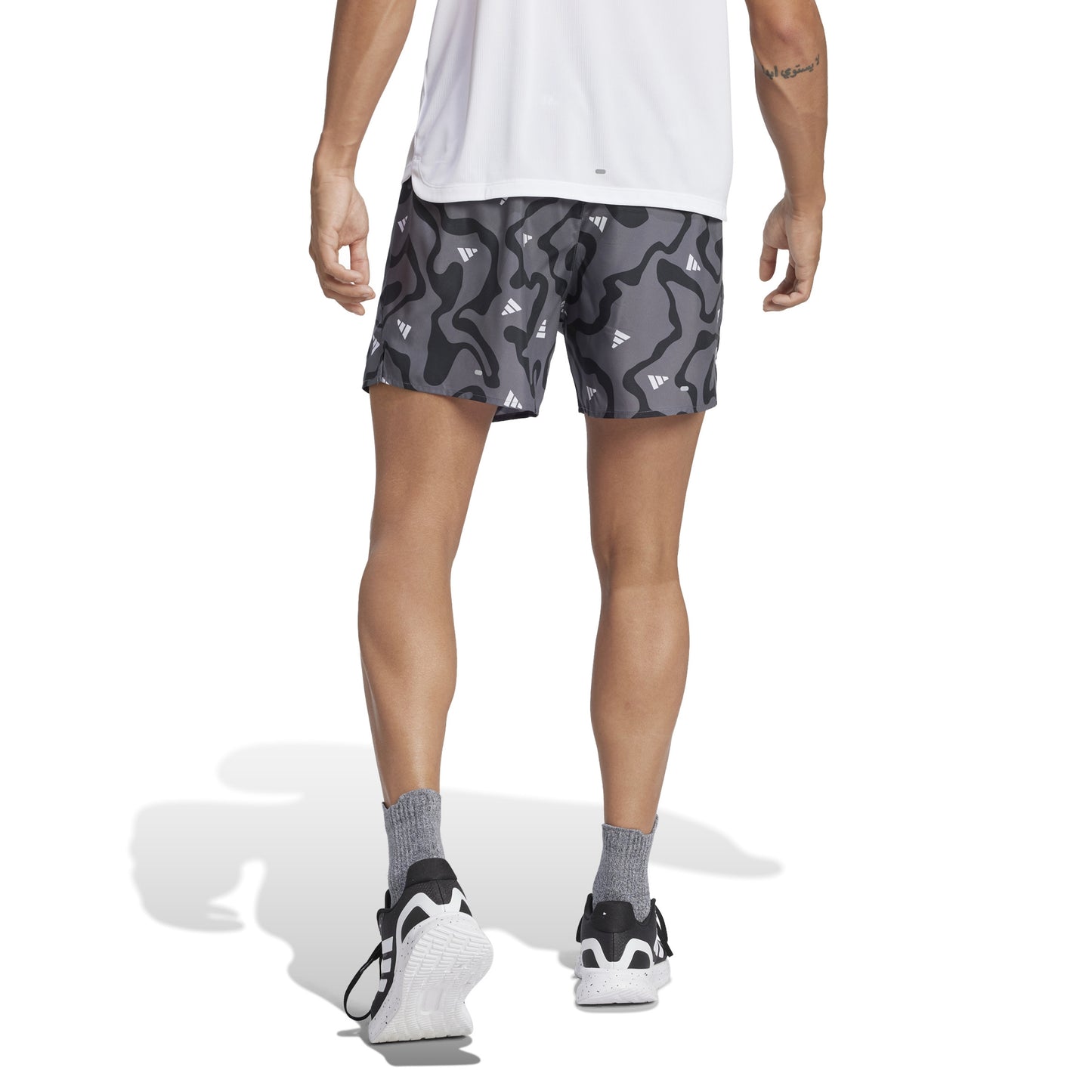 Man wearing Adidas grey patterned short 