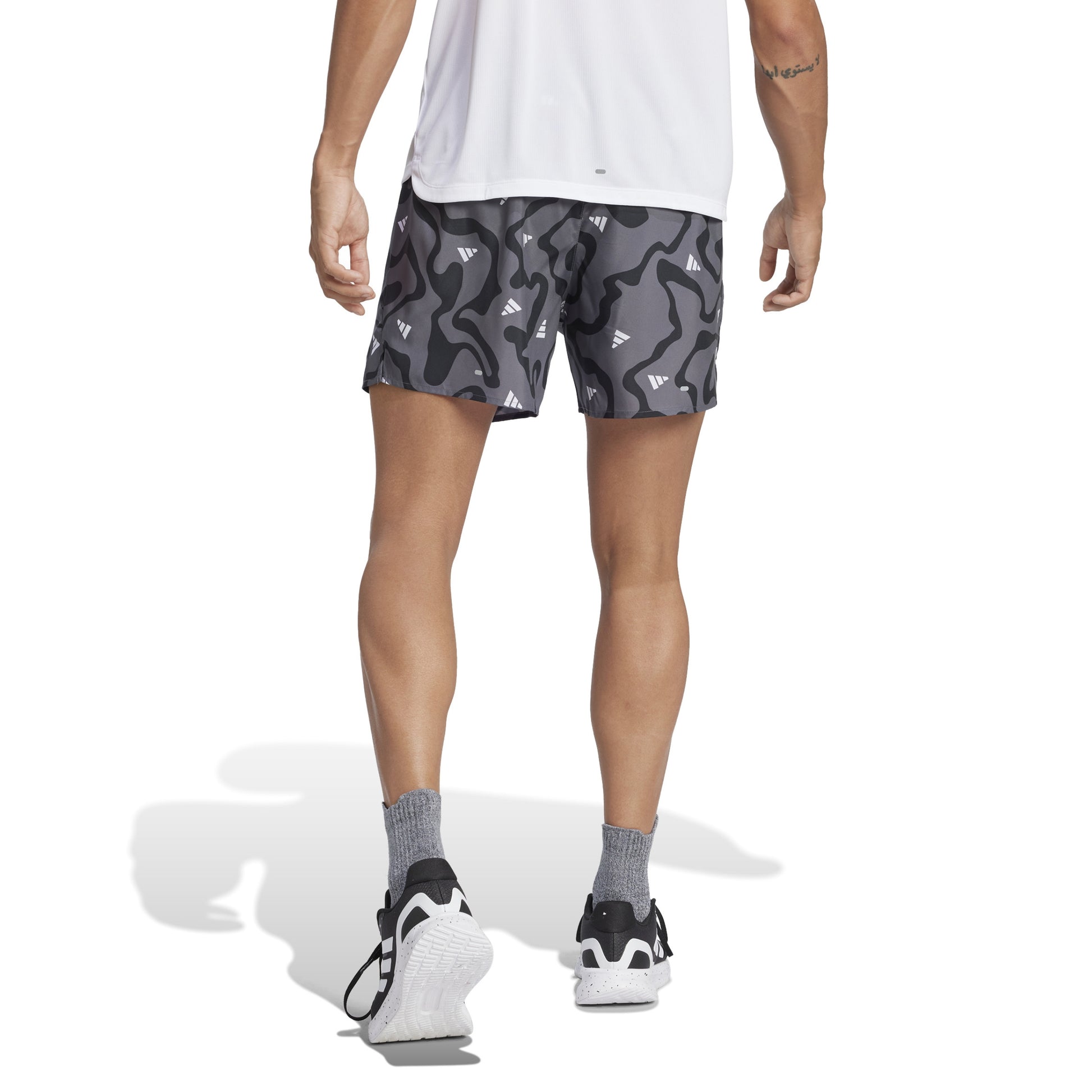 Man wearing Adidas grey patterned short 
