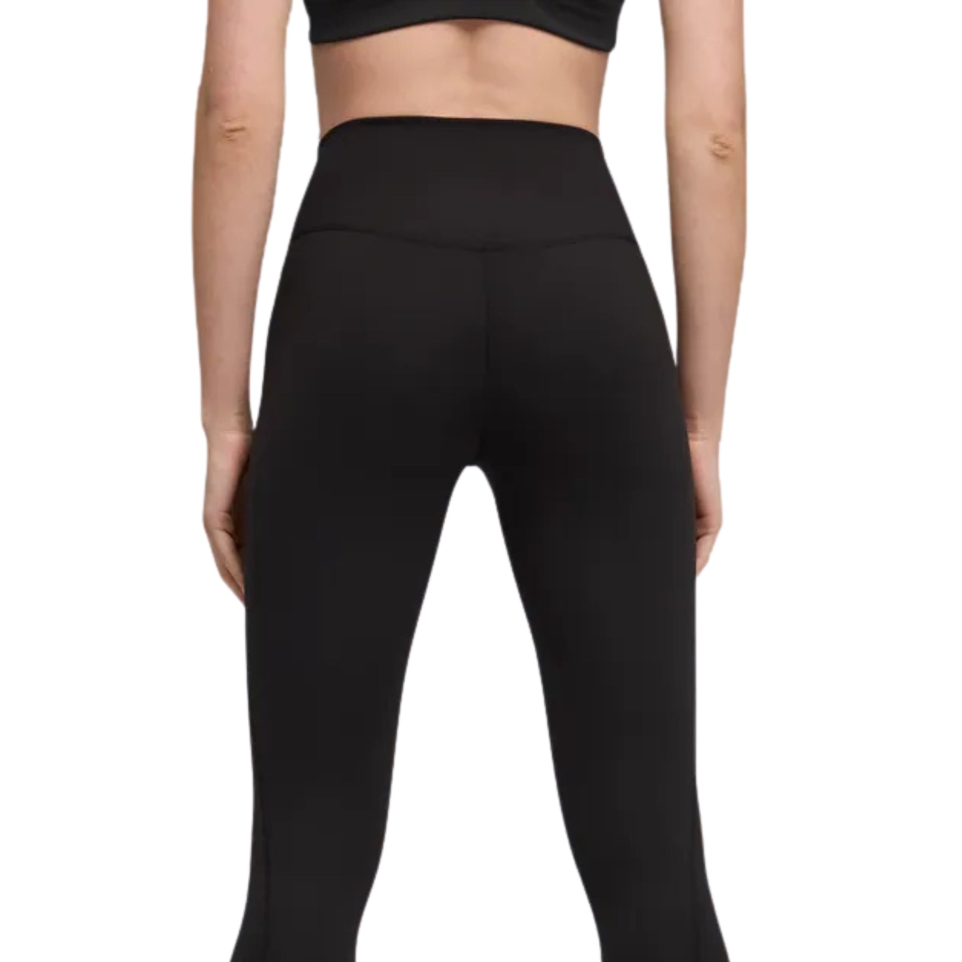Close-up of a woman wearing a black tight Puma pant on a white background