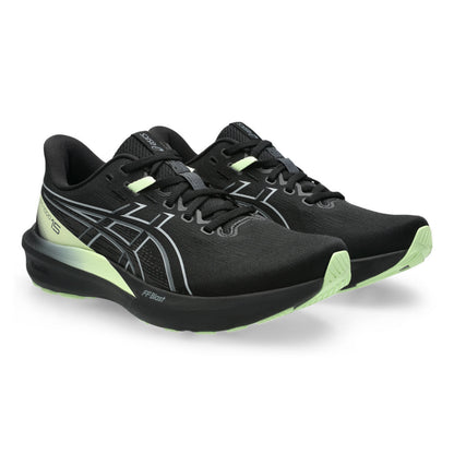 Black Asics running shoes with yellow accents on a white background