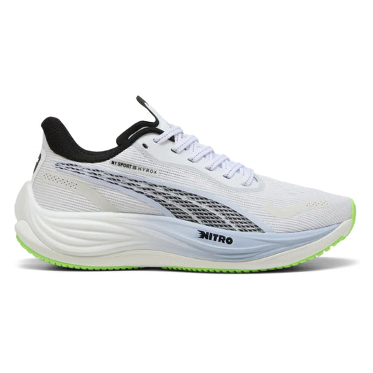 White Puma running shoe with black and green accents on a white background 