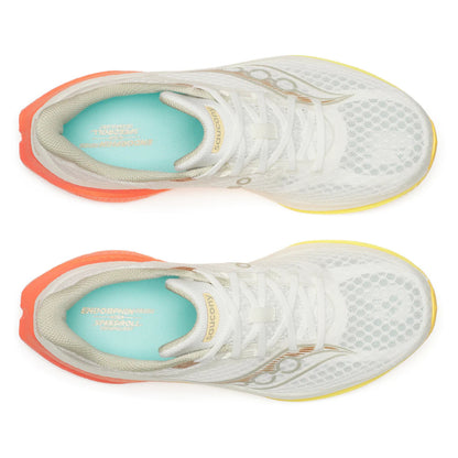 White Saucony running shoes with orange soles and visible brand logo on a white background