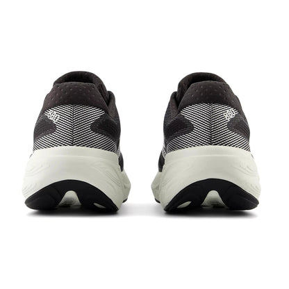 Black and white running shoes with brand logo on a white background