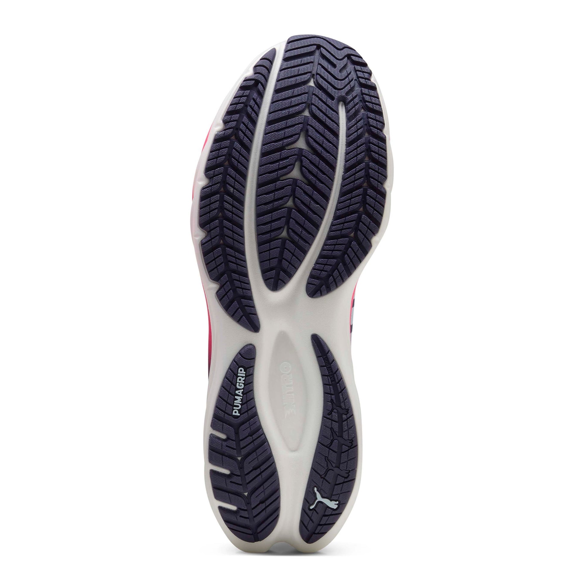 Close-up of a Puma running shoe sole with tread pattern on a white background