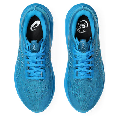 Pair of blue running shoes with brand logos on a white background