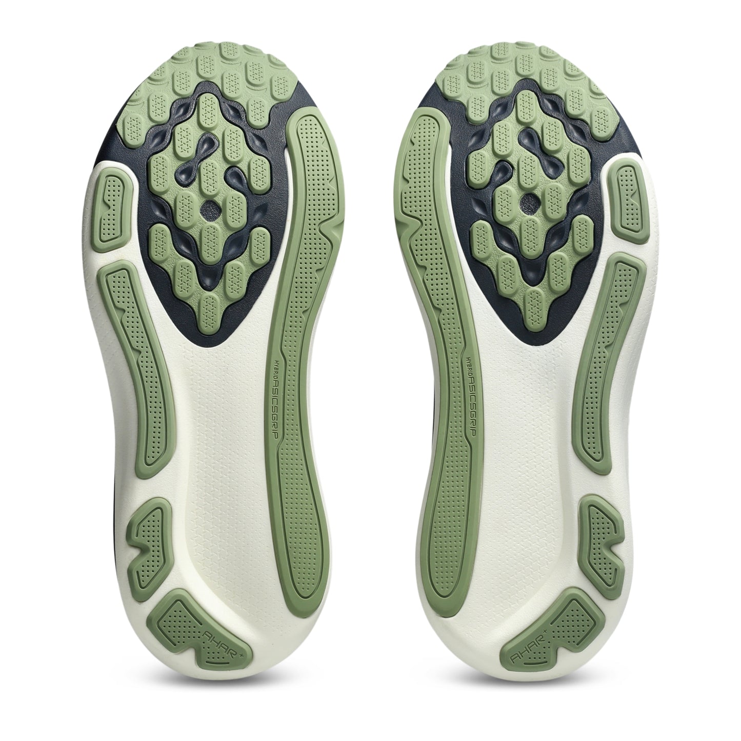 Close-up of a pair of white athletic shoes with green sole pattern on a white background