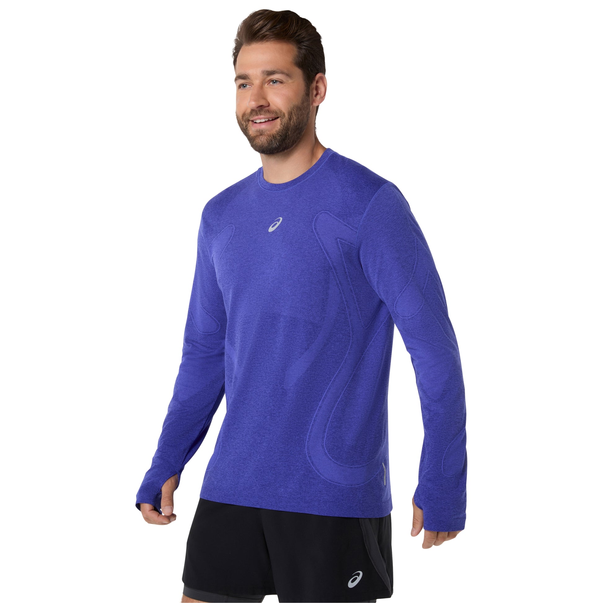Man wearing a blue long-sleeve athletic shirt with a visible brand logo on a white background