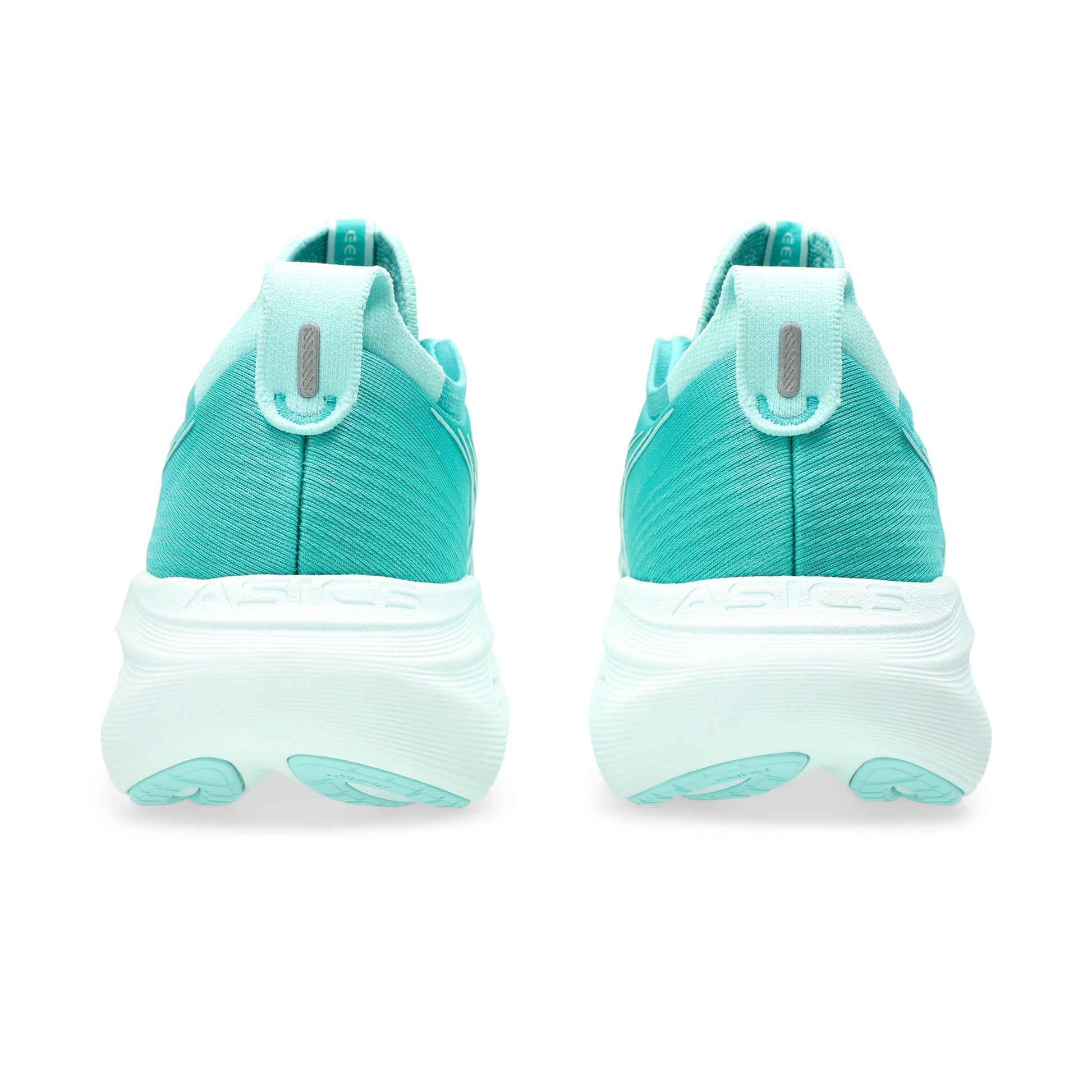 Teal running shoes with white soles on a white background