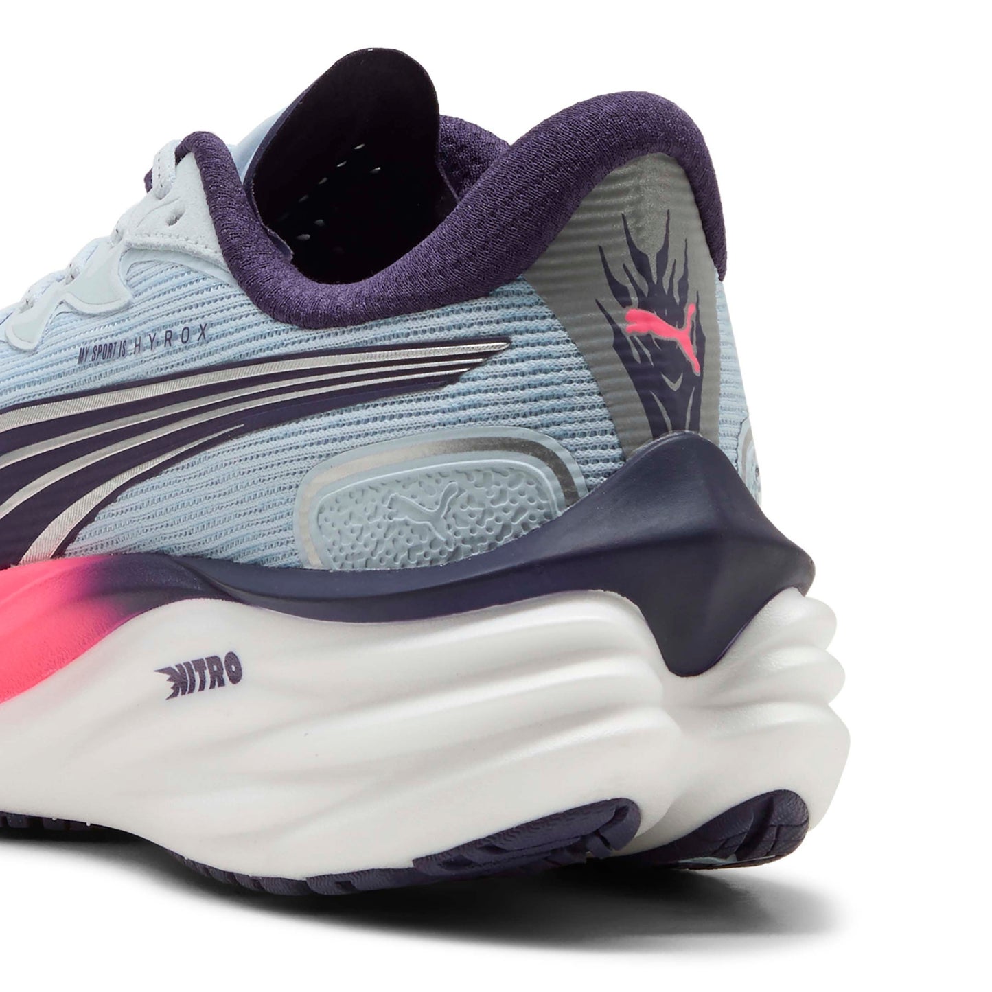 Puma running shoe with blue and pink accents on a white background