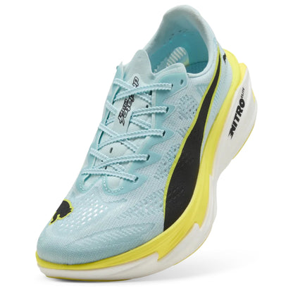 Light blue athletic shoe with yellow accents on a white background
