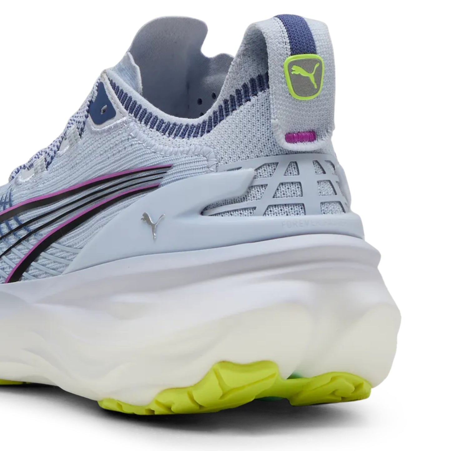 Puma running shoe with blue, white, and green design on a white background