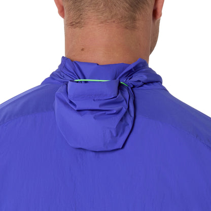 Close-up of a person wearing a hooded Asics jacket on a white background 