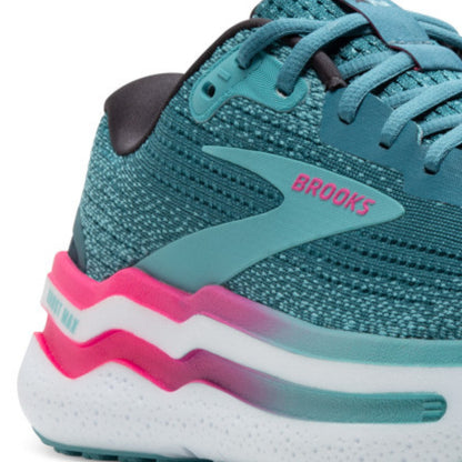 Storm blue running shoe with pink and white sole on a white background