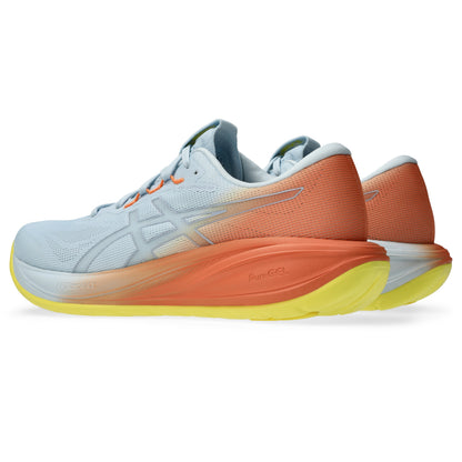 Pair of White and orange Asics running shoe with yellow accents on a white background