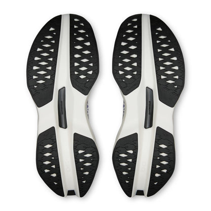 A pair of On running shoes shown from the sole view, featuring a black and white design with a textured, perforated pattern on the outsole.