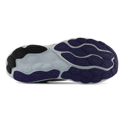 Close-up of a shoe sole with purple and black pattern on a white background