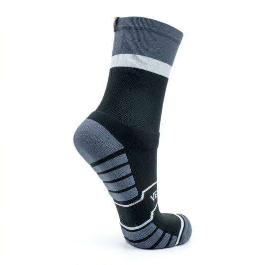 Black and gray sock with white stripe on a white background