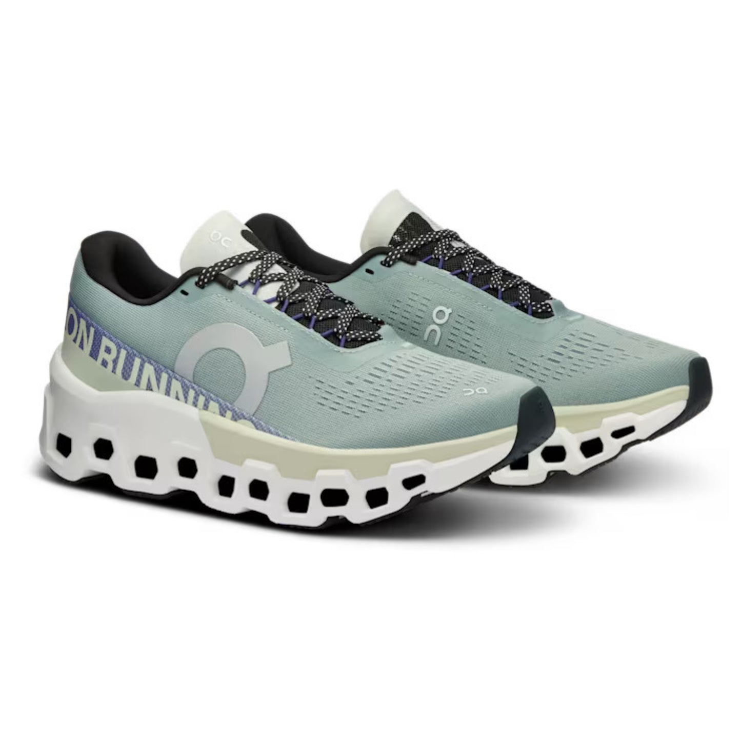 Pair of green ON running shoes on a white background