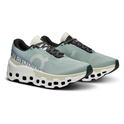 Pair of green ON running shoes on a white background