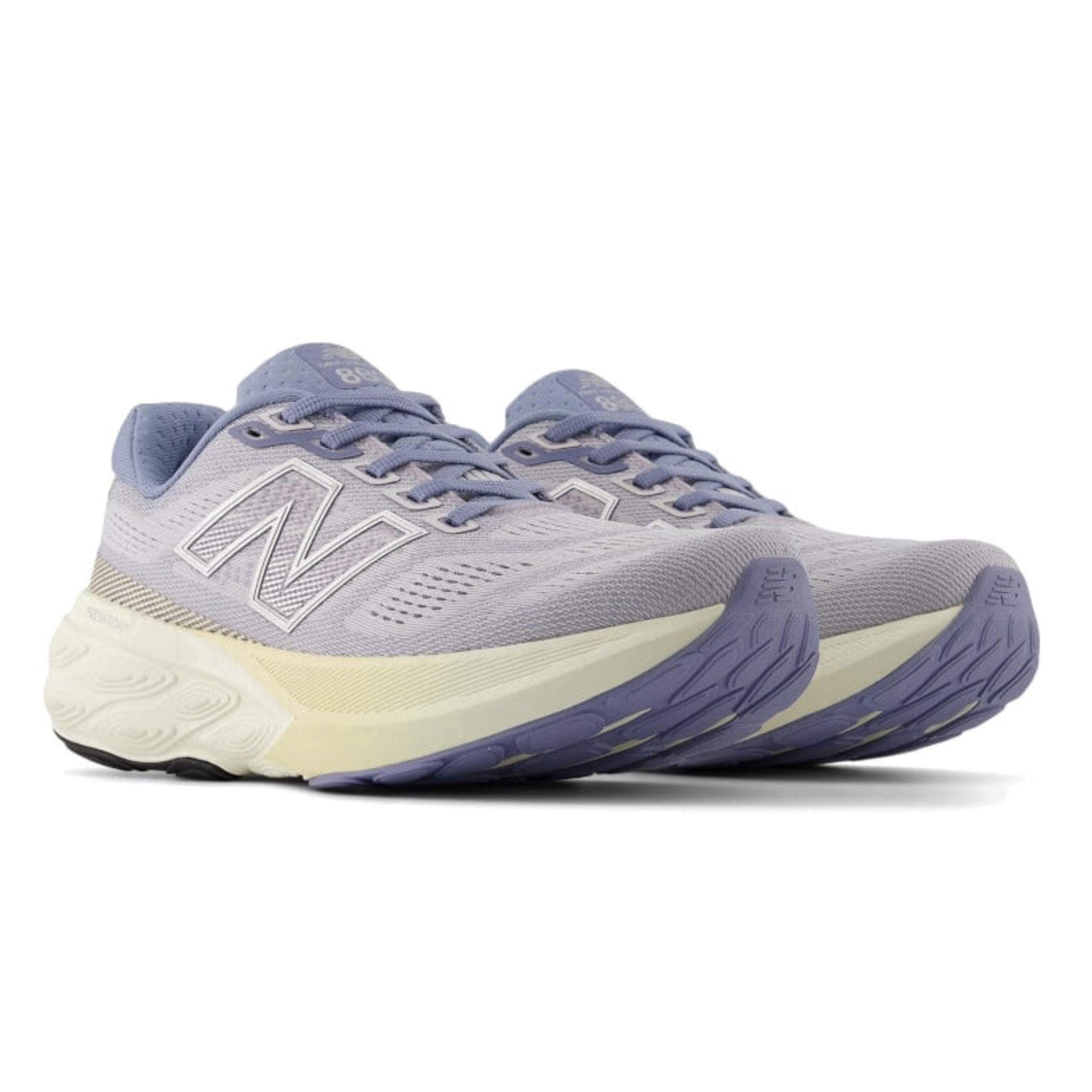 Pair of Light Purple New Balance running shoes on a white background