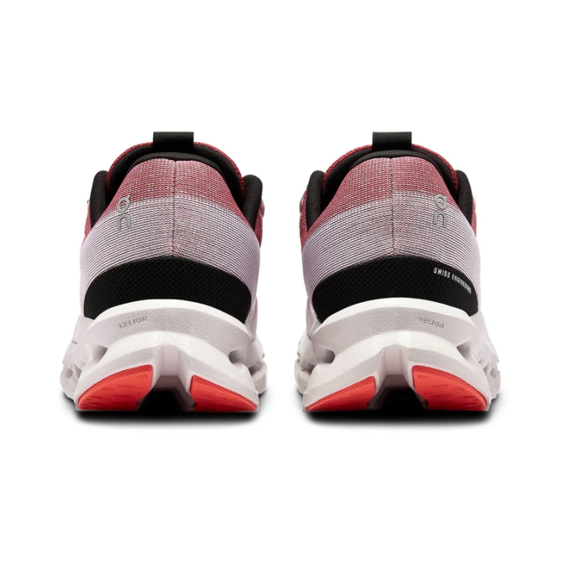 Back view of a pair of running shoes with red accents on a white background