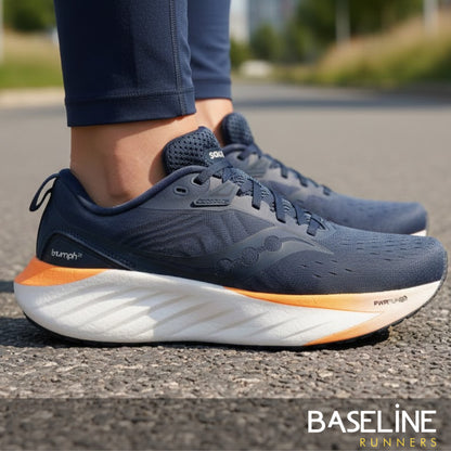 Dusk Saucony running shoe being worn by a runner on a paved road 