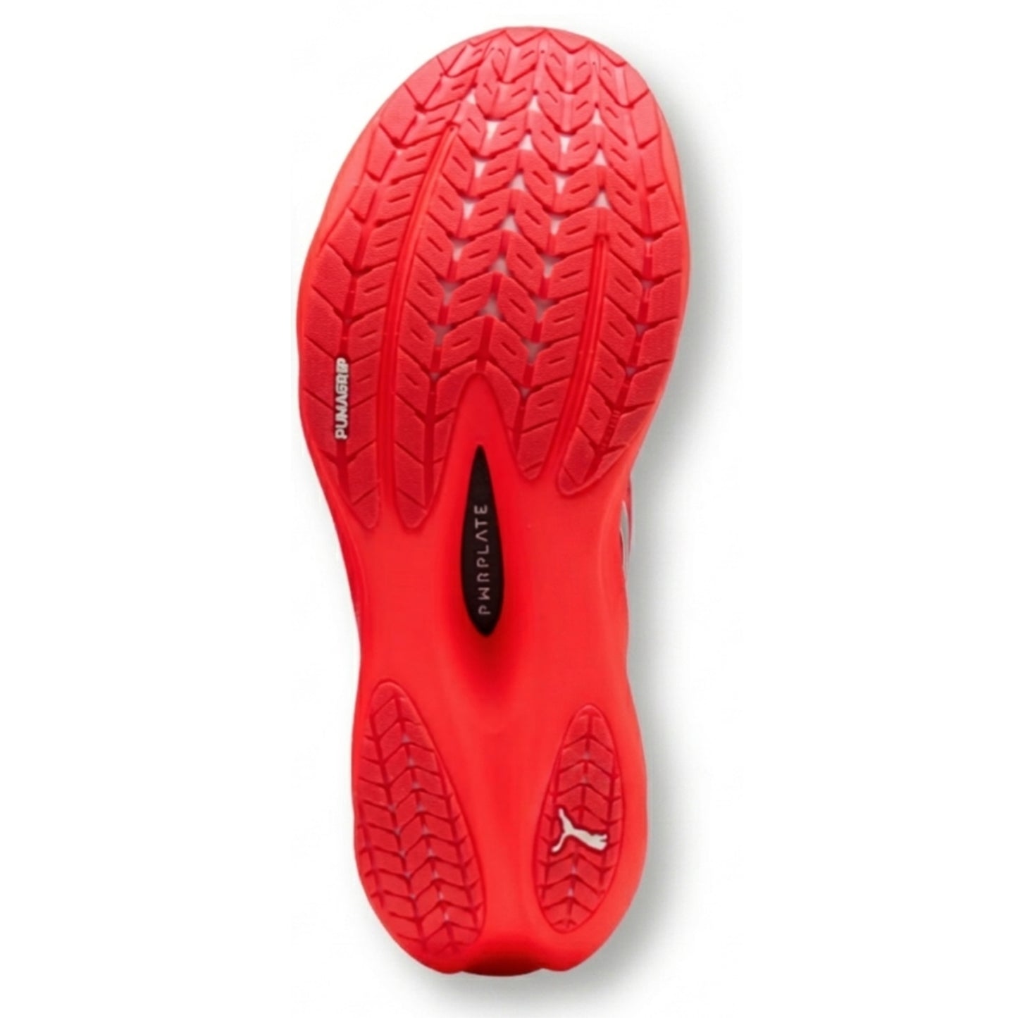 Red Puma running shoe sole with tread pattern on a white background