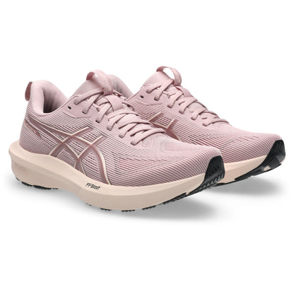 Pink running shoes on a white background
