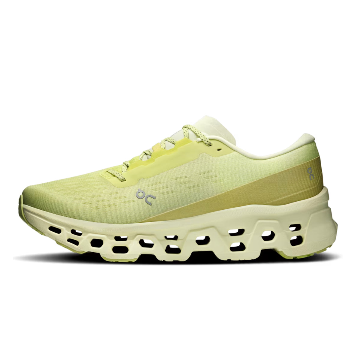 A single running shoe in a pale yellow-green colorway, shown from the side against a solid white background. The shoe features a textured mesh upper, a thick sculpted sole with multiple cutouts, and a small 'on' logo on the side.