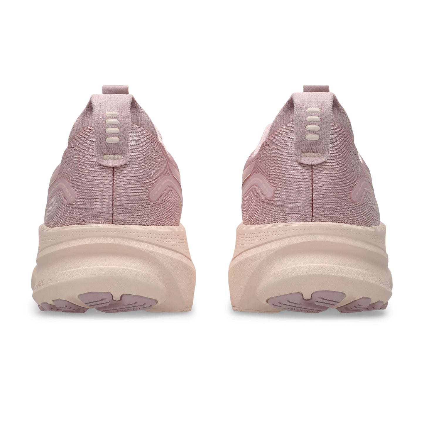Pink running shoes with a thick sole on a white background