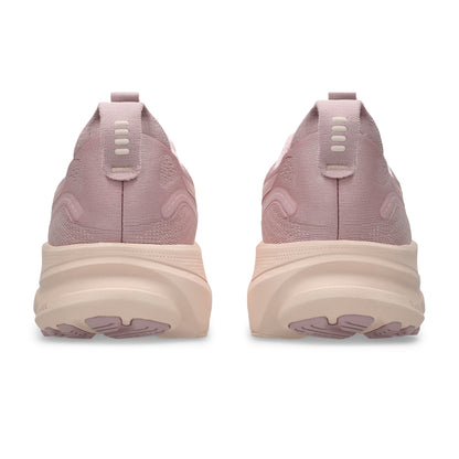 Pink running shoes with a thick sole on a white background