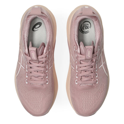 Pair of pink running shoes on a white background