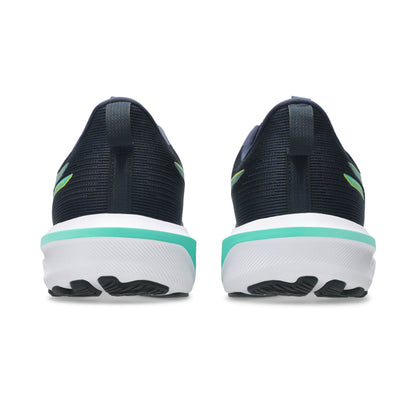 Black running shoes with green accents on a white background