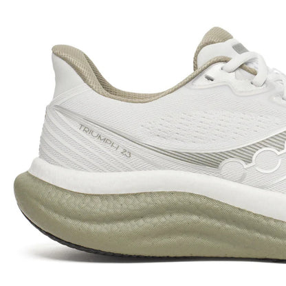White and beige Saucony running shoe with 'Triumph' branding on a white background