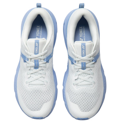 White and blue running shoes with Yonex branding on a white background