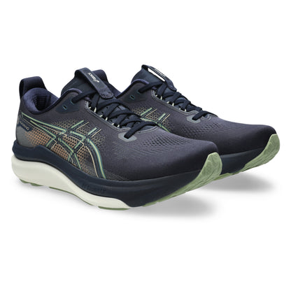 Navy blue Asics running shoes with green and gold accents on a white background