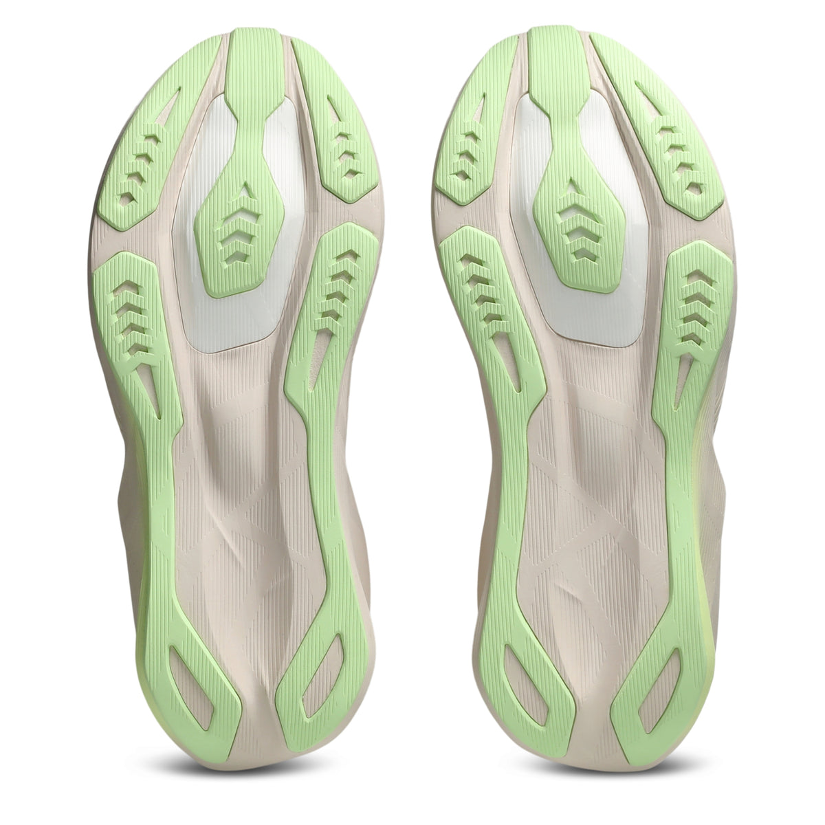 A pair of athletic shoes shown from the sole view, featuring a light beige textured midsole with mint green and white sculpted outsole details, set against a plain white background.