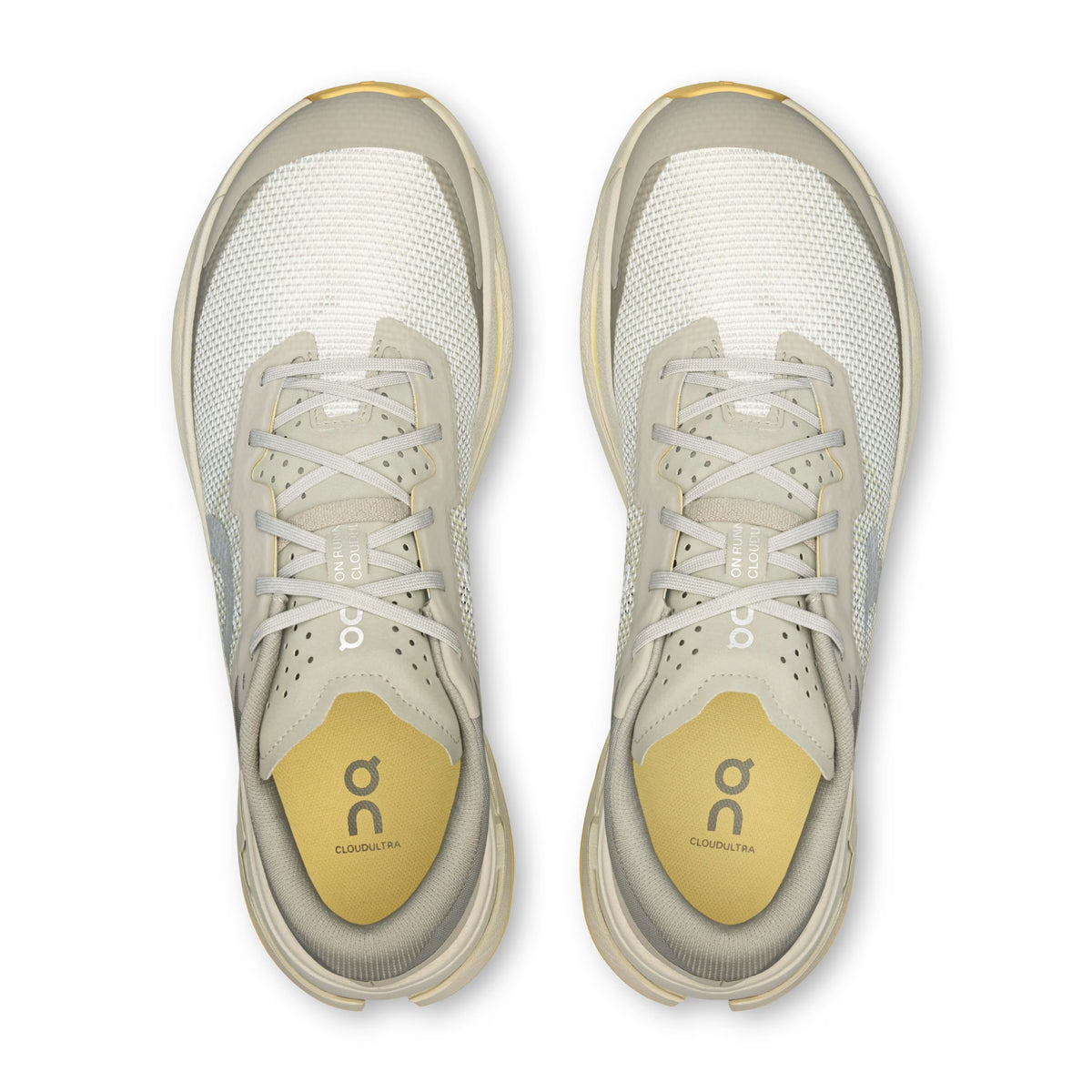 Grey On running shoes with blue wording and yellow sole on  a white background