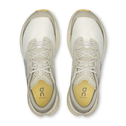 Grey On running shoes with blue wording and yellow sole on  a white background