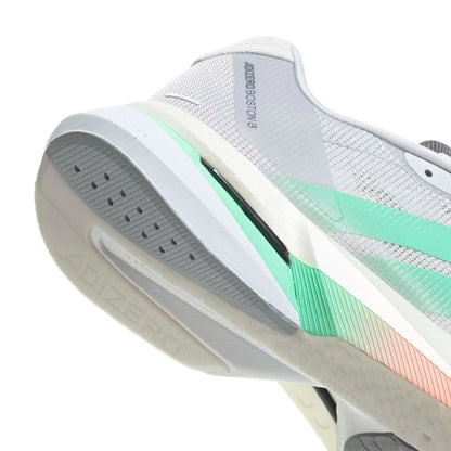 Close-up of a white and gray running shoe showing the midsole, heel area, and a mint green to peach gradient accent stripe, with 'ADIZERO' and 'ADJUSTER 3.0' text visible.