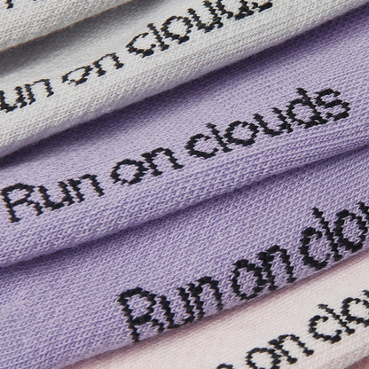 Close-up of the bottom of On socks with writing "Run on Clouds" 